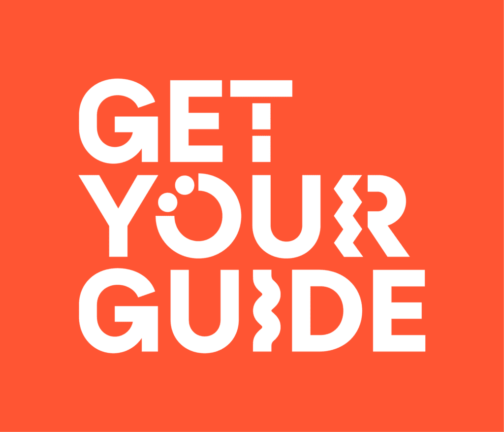 MAIN - GetYourGuide stacked logo - white on guiding red (RGB) (1)
